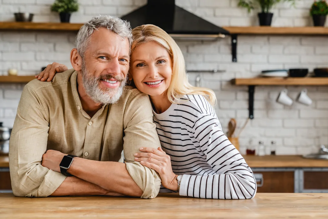 Happy middle-aged couple in the kitchen