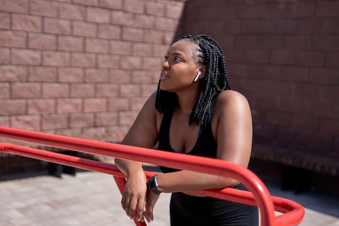 Woman pausing during outside workout
